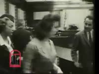 Series of WSB-TV newsfilm clips of defendants, attorneys and other personnel in a courtroom of an unidentified case, 1961