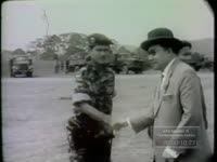 LEADER TOURS COUNTRYSIDE AND IS GREETED BY MILITARY OFFICIALS (1963)