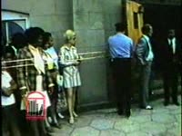 WSB-TV newsfilm clip of crowds waiting outside of Ebenezer Baptist Church as the body of Alberta Williams King, mother of Dr. Martin Luther King, Jr., lies in state, Atlanta, Georgia, 1974 July 2