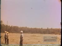 FILM OF HELICOPTER AIDING LOGGERS