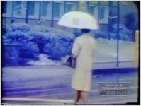 FILM OF MEN WAITING IN CAR IN PARKING LOT (NO DATE)