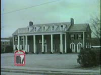WSB-TV newsfilm clip of the Kappa Alpha Order fraternity at the University of Georgia flying the Confederate battle flag at half-mast following the university's court-ordered integration in Athens, Georgia, 1961 January 16