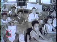 Series of WSB-TV newsfilm clips of an interracial classroom, interviews with Armand Duvio and Louise Tate, a reporter speaking about the influence of the Louisiana legislature, and outtakes from commentary on the school integration crisis in New Orleans, Louisiana, 1960 December