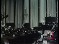 Construction and procedural changes in the House chamber. Footage of Carl Sanders. Footage of Georgia industry sign. (Sometime between 1963-1967.)