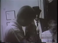 MEN IN COBB COUNTY POLICE CUSTODY BEING PHOTOGRAPHED AND FINGERPRINTED