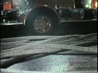 FIREMEN CLEAN UP FOLLOWING FIRE AT "SCENE"