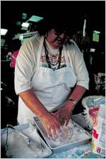 Vernie "Desert Flower" Martin prepares fry bread at the Cherokee Tribe of Georgia pow wow in St George