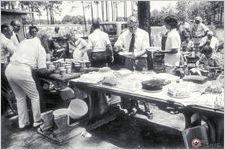Members of the Royal Family Singing Convention in Mystic take a break from the singing to fill their plates with home cooked food and enjoy another year's "dinner on the grounds" Photo by Howard Marshall