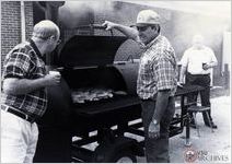 Grilling chicken for the dinner on the grounds at 2001 All-Day Sacred Harp Sing