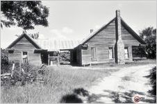 An abandoned frame central hall house near Live Oak Church in Turner County