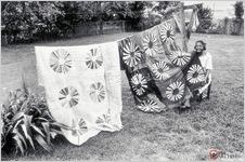 Quilter Fannie Lee Teals of Tifton shows her "Wheel of Fortune" and "Bicentennial" quilts