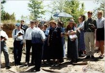 Clarke Lee (back to camera) leads singing from the Lloyd Hymnal