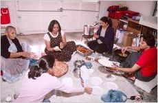 Women gather to make the Indian sweet gulab jamun