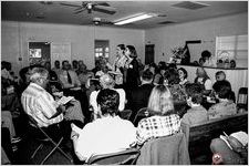 Jenny and Stephanie Steuver lead in center of hollow square Tri-State Sacred Harp Convention