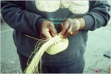 Making sweetgrass baskets at Charleston market