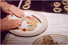 Women rolling out cookies at home of Noel and Roberta George