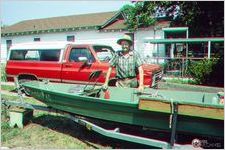 Calvin Eunice with homemade wooden boat