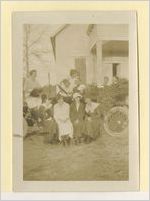 Photograph of a group of women with a car, Ludowici, Georgia