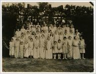 Photograph of Girls and Women in Pink Dresses Holding Peach Blossoms, Peach Festival, Fort Valley, Peach County, Georgia, 1924