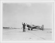 Photograph of man waving in airplane, Bainbridge Army Airfield, Bainbridge, Georgia, c. 1944